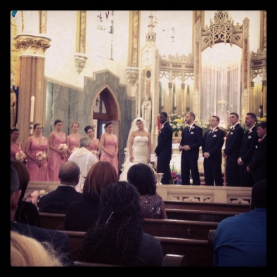 A faraway shot of the wedding party in the GORGEOUS basilica!